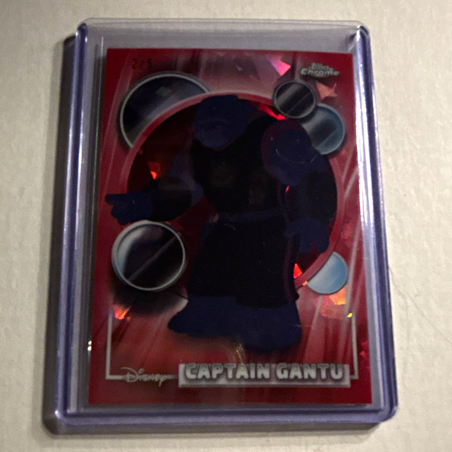 2026 Topps Chrome Disney Captain Gantu #155 Red Refractor 2/5