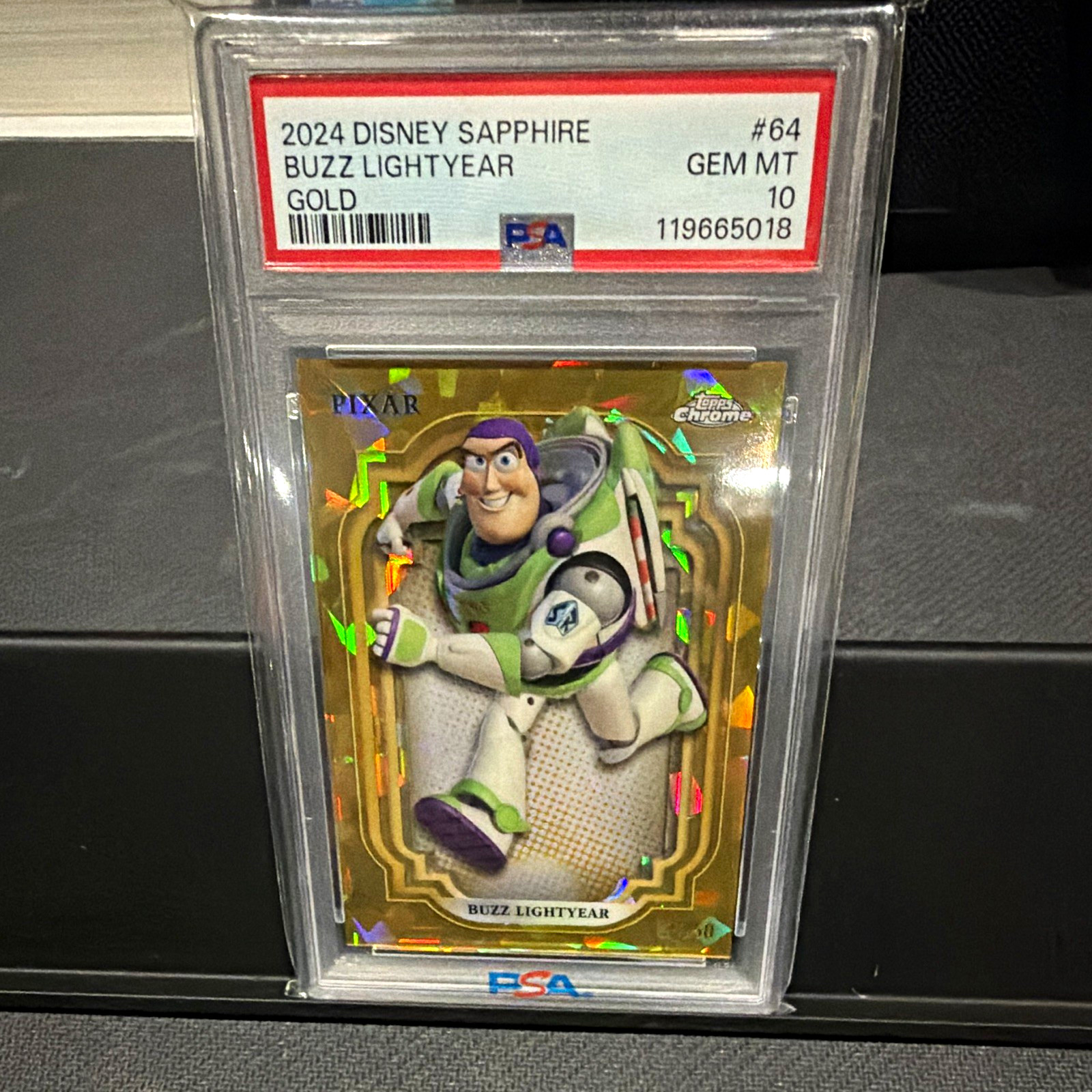 Topps 2024 Disney Sapphire Buzz Lightyear Gold Parallel /50 #64 PSA 10 Topps 2024 Disney Sapphire Buzz Lightyear Gold Parallel /50 #64 PSA 10