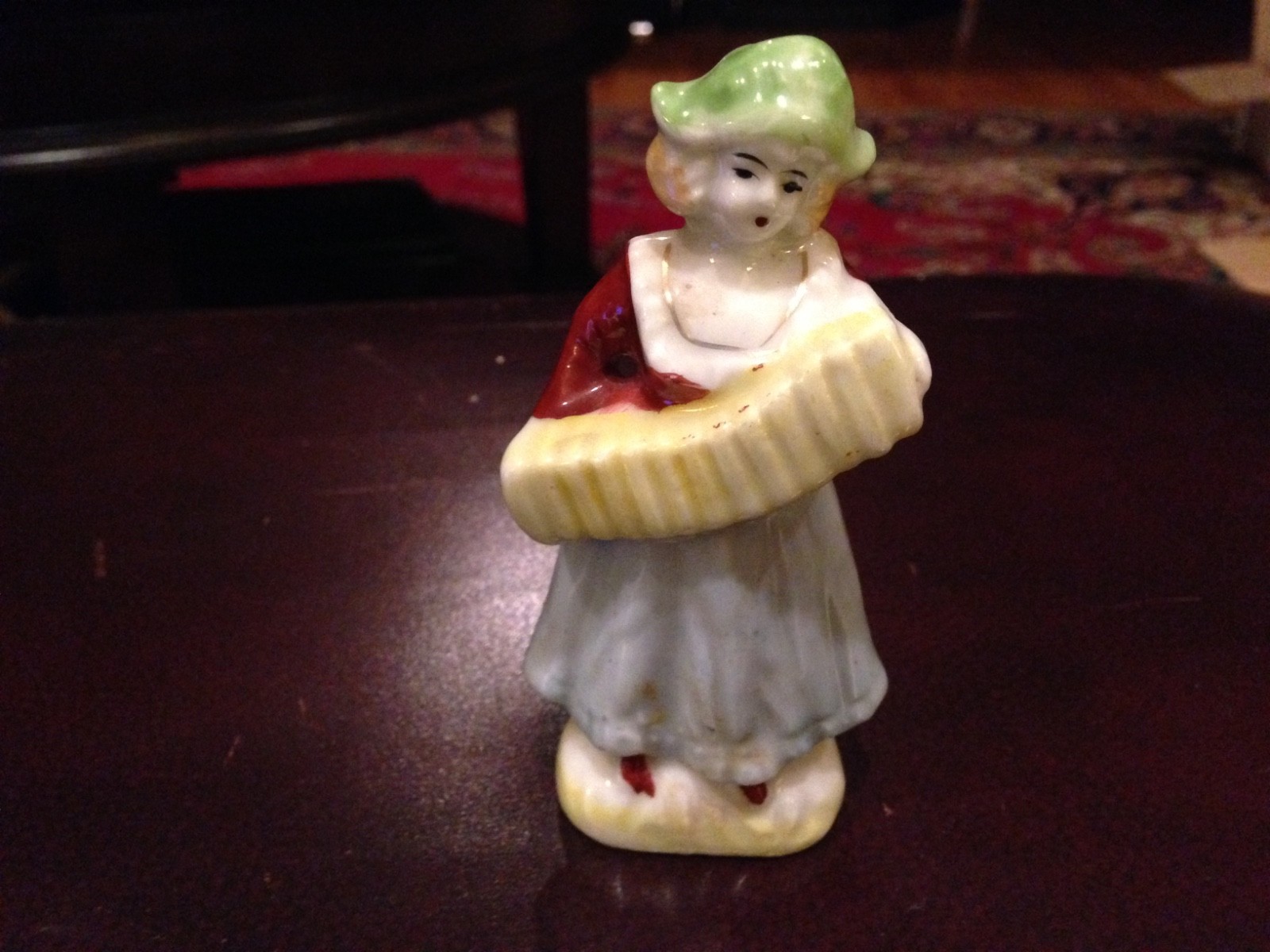 Girl Dressed in Blue Playing Accordion Figurine