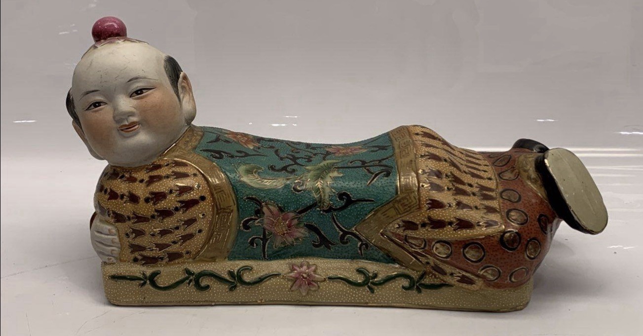 Chinese porcelain reclining boy opium pillow