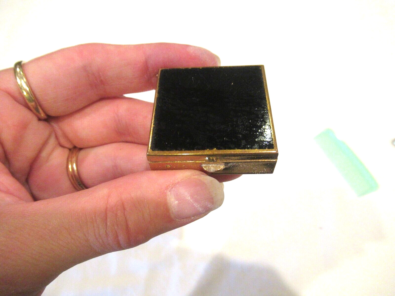 Black and gold powder compact, c. 1940s