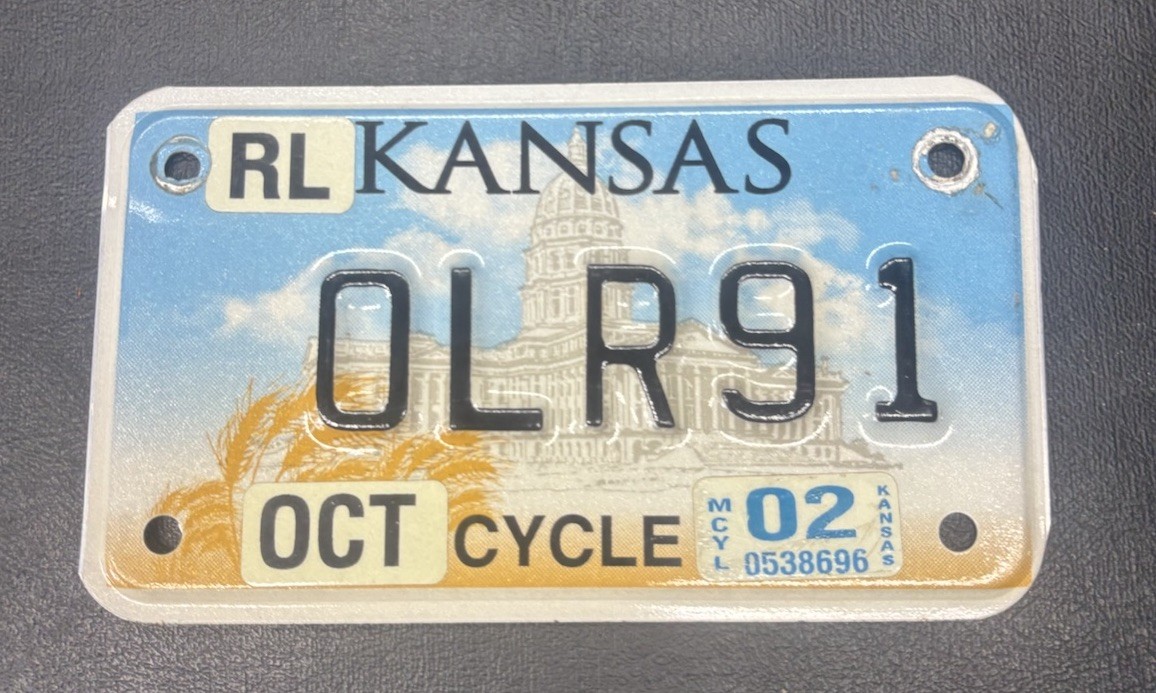 2002 Kansas Motorcycle License Plate — Riley County (RL OLR91)