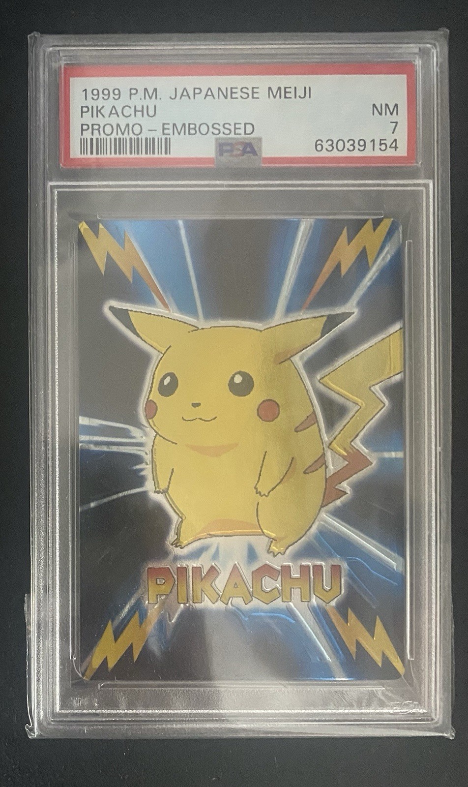Japanese Pokemon Card - Pikachu Embossed Meiji Promo 1999 PSA 7 POP 68