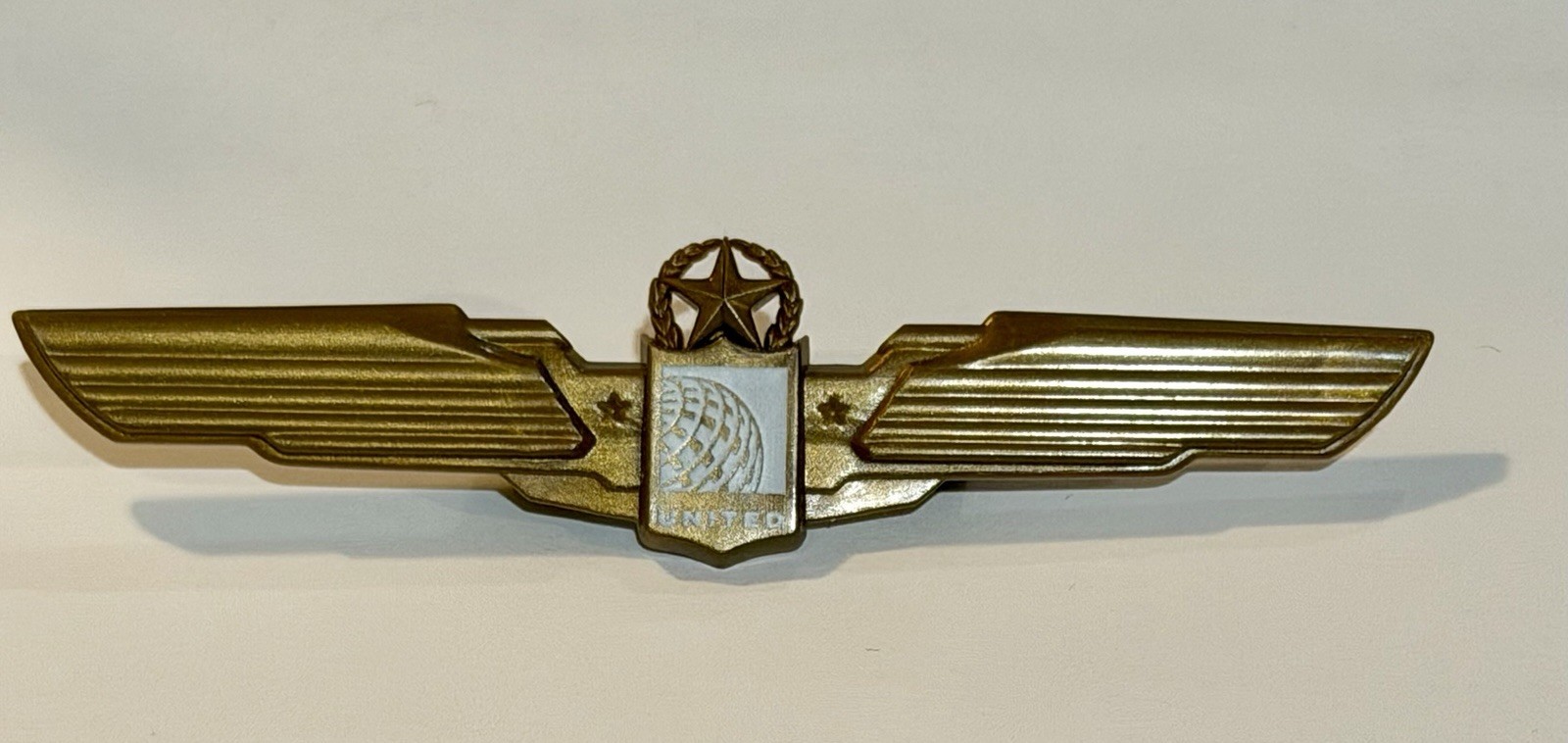 Vintage United Airlines Pilot Wings Pin, plastic, 3-3/8 inches Vintage United Airlines Pilot Wings Pin, plastic, 3-3/8 inches