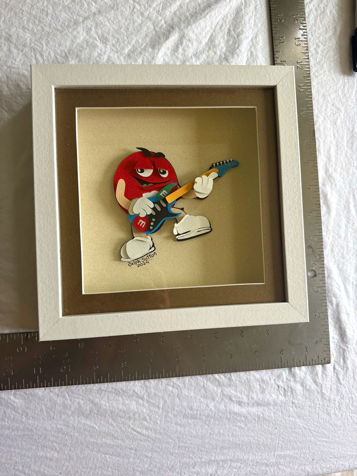 M&M\'s Red Character Guitarist Display Art White Frame Handcut Paper Art 9x9