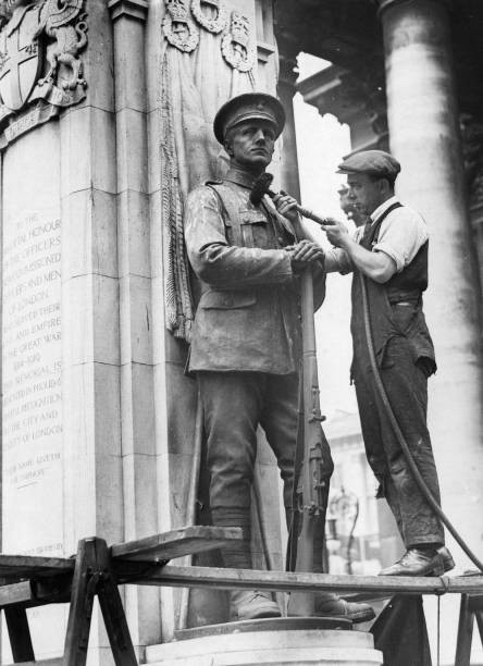 Worker uses a flexible drive to assist with cleaning process of thi- Old Photo