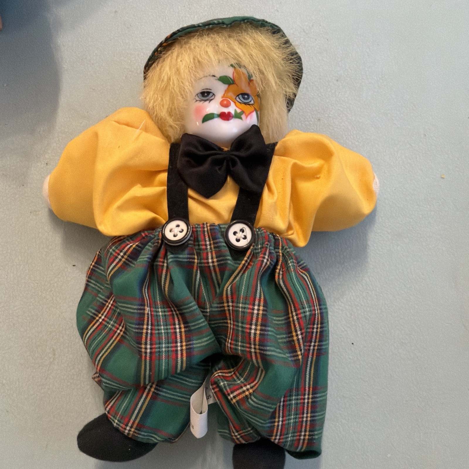 vintage 1990s-era porcelain head clown doll