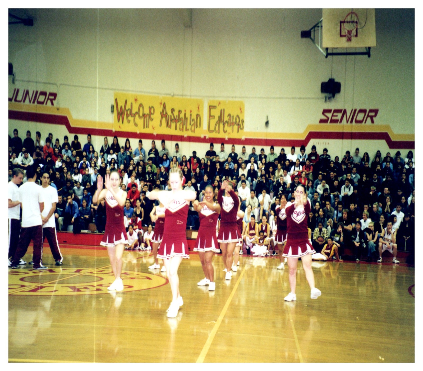 1990s High School Cheerleaders Performing Gym Welcome Banner Vintage Photo