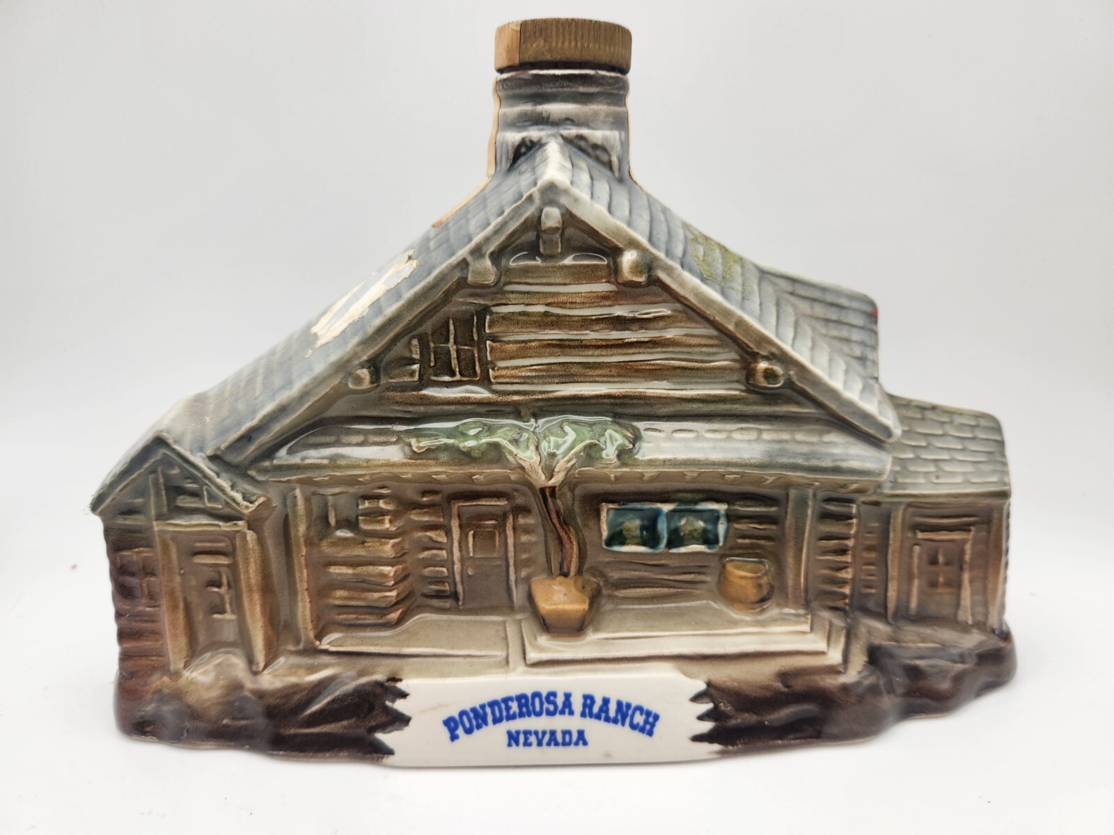 Vintage 1969 Jim Beam decanter of the Ponderosa Ranch in Nevada. Regal China.