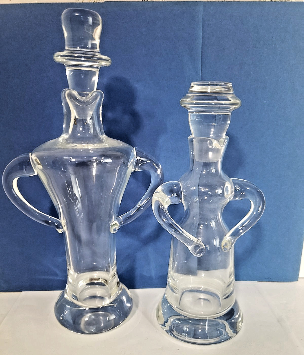 NEIMAN MARCUS PAIR OF CLEAR GLASS MAN & WOMEN OIL HOLDERS