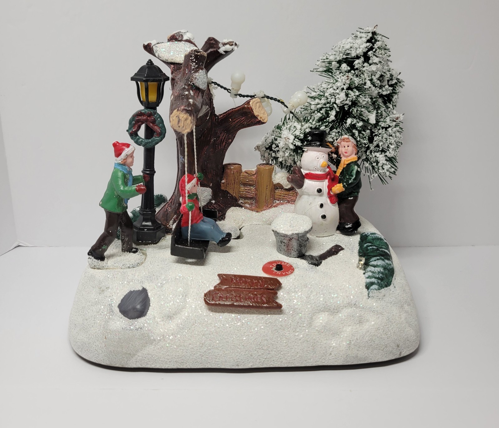 Holiday Lighted Snowy Scene With Kids, Swing And Snowman