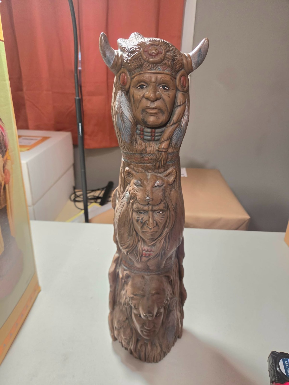Vintage hand painted ceramic Native American totem pole featuring tribal heads