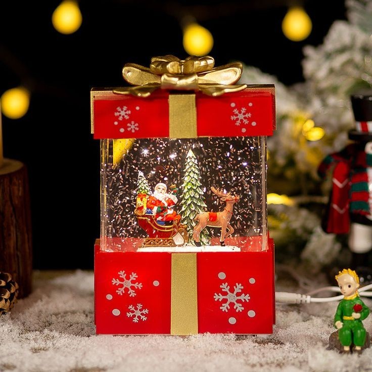 Avon Light Up Gift Box Santa Claus Reindeer Snow Globe New in Box