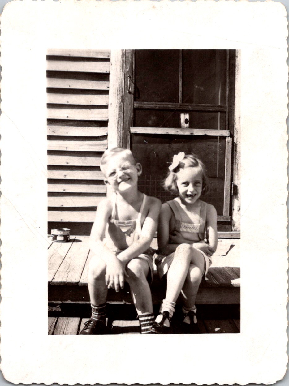 Two Smiling Children on Porch, 1940s B&W Snapshot Photo