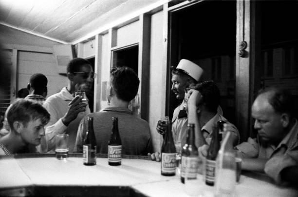 people drinking bier seated in a cafe Martinique 1950s Historic Old Photo