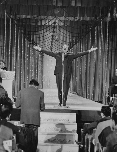 Italian singer songwriter actor Domenico Modugno performing song L- Old Photo