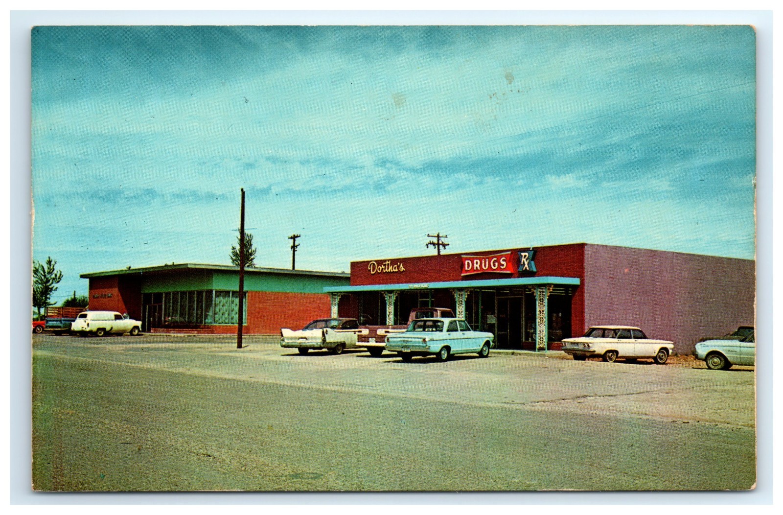 Postcard Street Scene Plains Texas c1960s Cars Dorthas Shop Drugs Pharmacy UNP