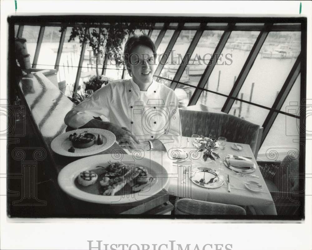 1991 Press Photo Chef James Poitrast of Reflections at Bayside shows dishes