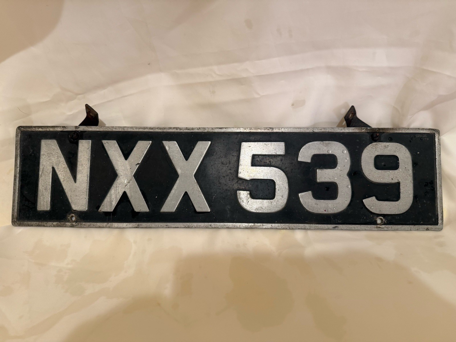 1940-50’s British Embossed License Plate IU 6357 made by Homo Hygrade 18” x 5”