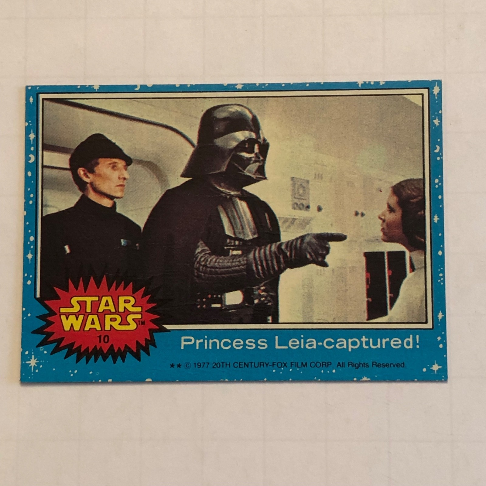 1977 Topps Star Wars #10 Series 1 Blue “Princess Leia - captured” Darth Vader