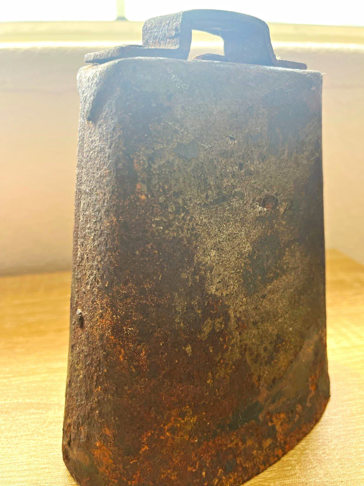 Antique hand-forged metal cow bell from the mid-late 19th century