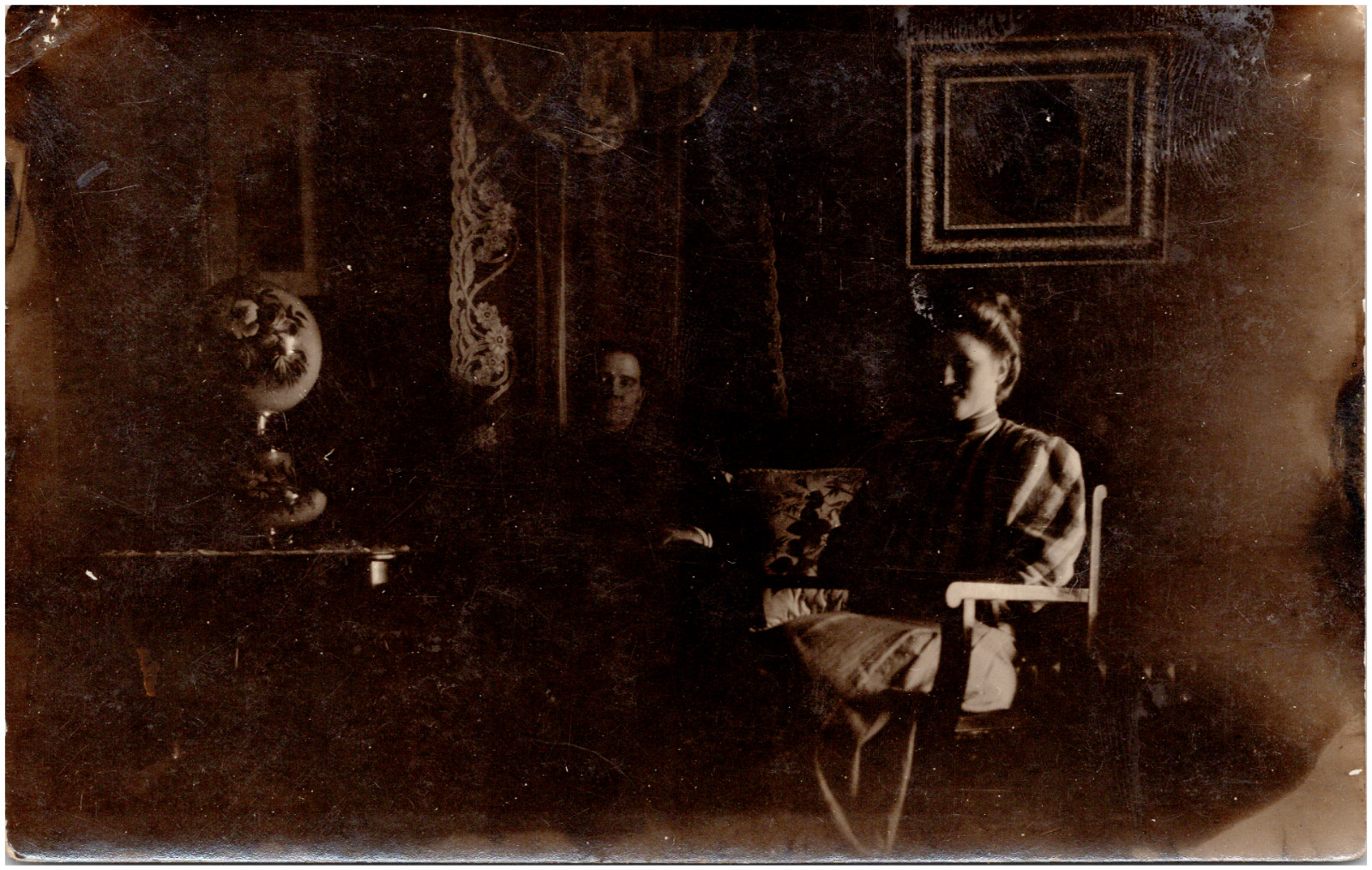 Man & Woman Sitting in Dark Room Dramatic Lighting 1900s RPPC Postcard Photo