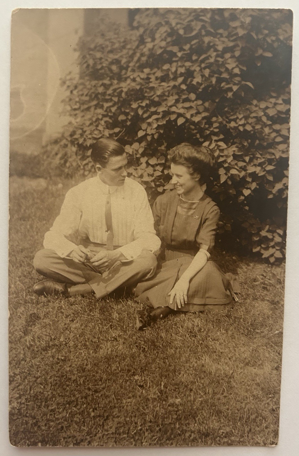 Antique RPPC Young Couple Sitting on Grass Outdoor Portrait 1911 Photo Postcard