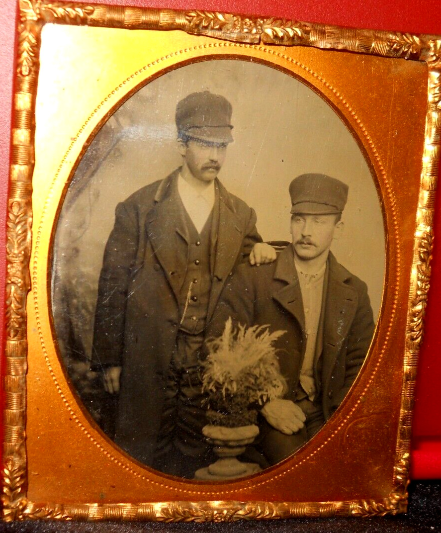 1/6th Size Tintype of two men in caps in brass mat/frame