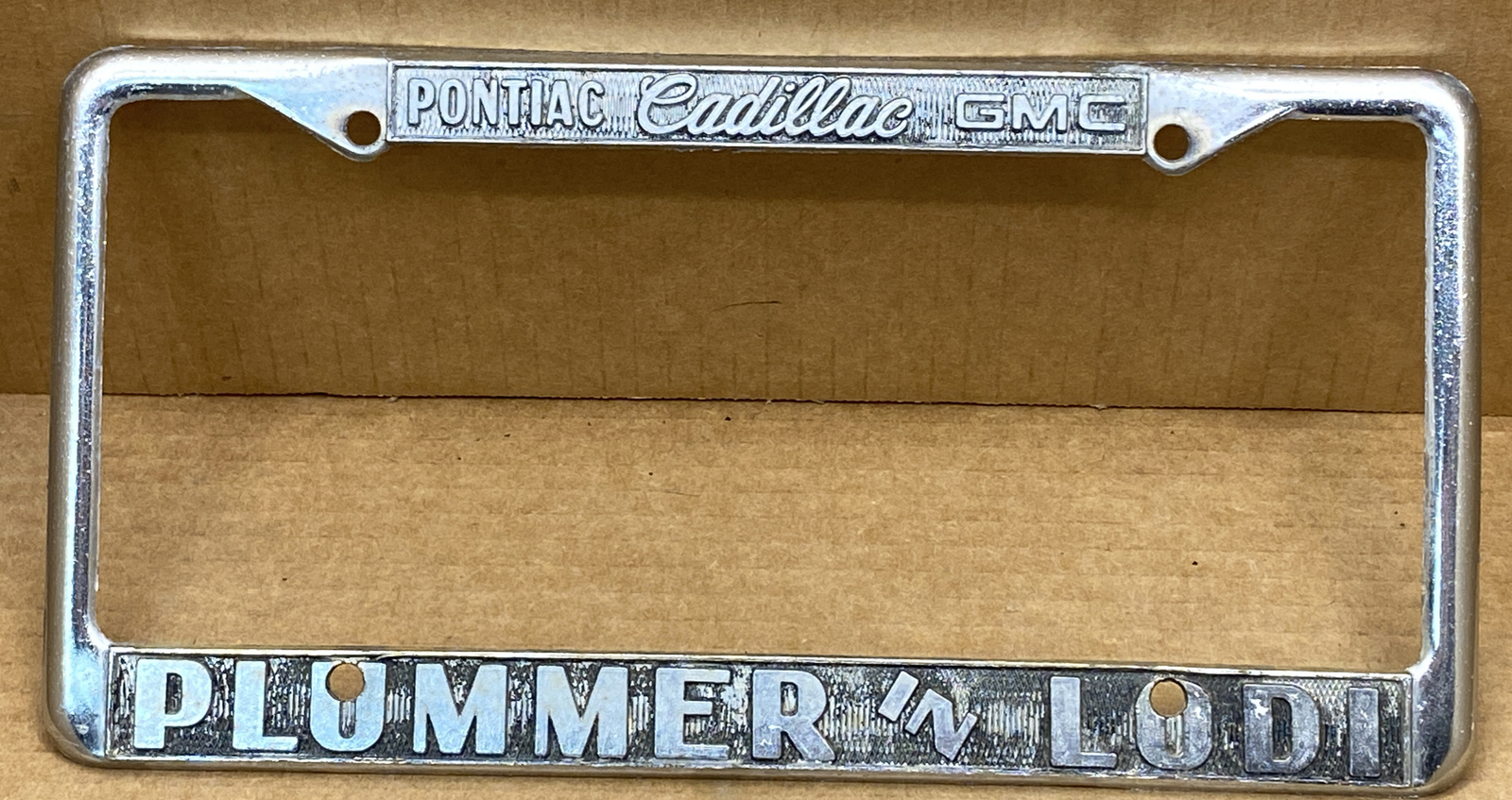 RARE 1980s PONTIAC/CADILLAC/GMC ( LODI CA.) PLUMMER IN LODI LICENSE PLATE FRAME