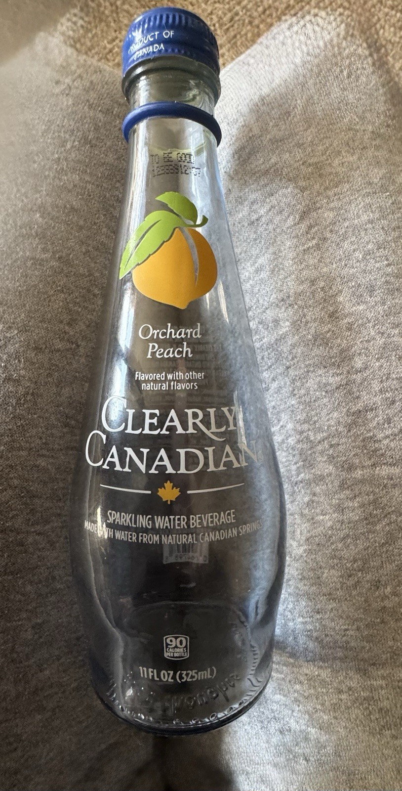 Clearly Canadian, Orchard Peach, Empty, Glass Bottle, with Rare Blue Metal Cap. Clearly Canadian, Orchard Peach, Empty, Glass Bottle, with Rare Blue Metal Cap.