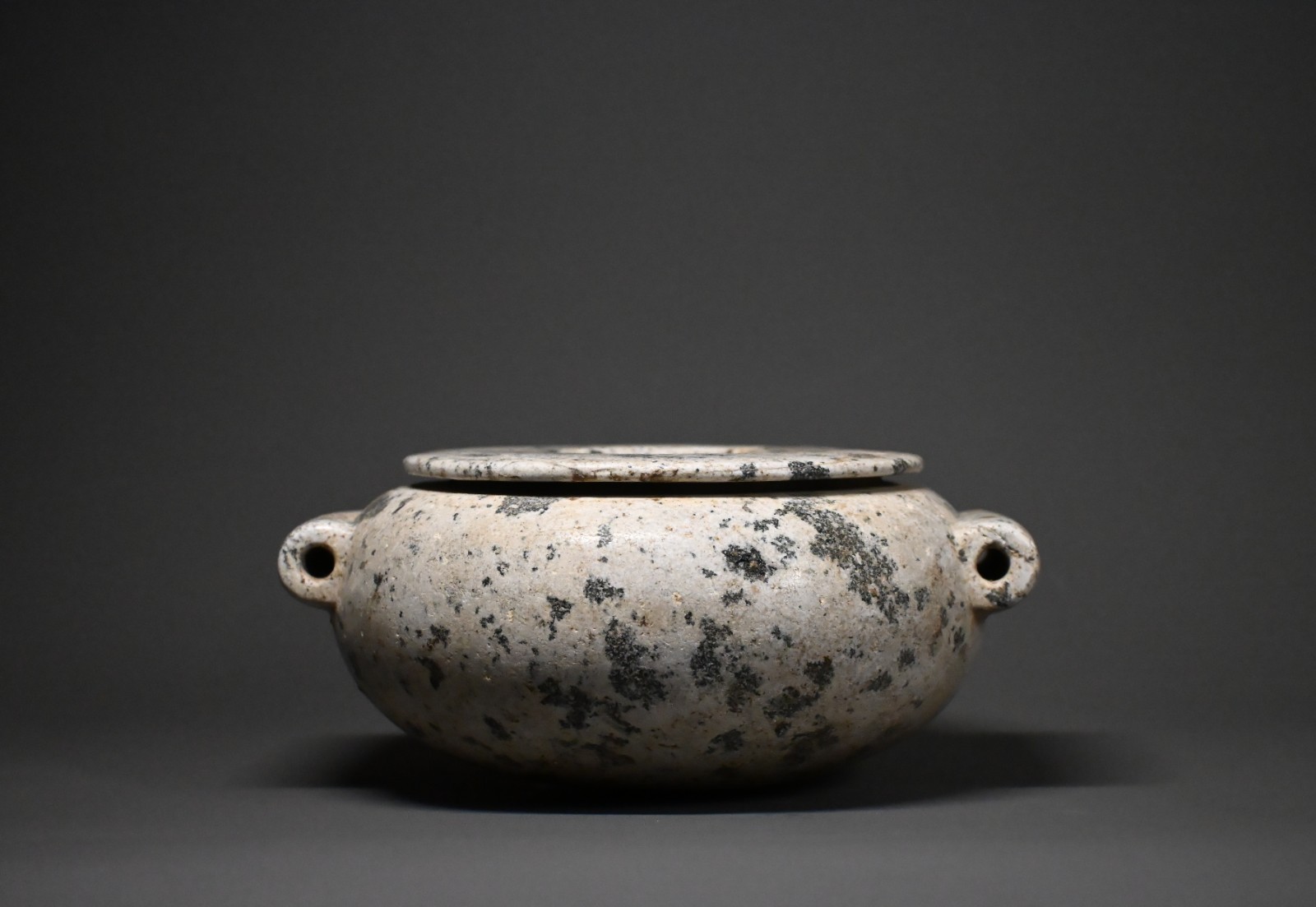 CIRCA AN EGYPTIAN DIORITE STONE JAR.
