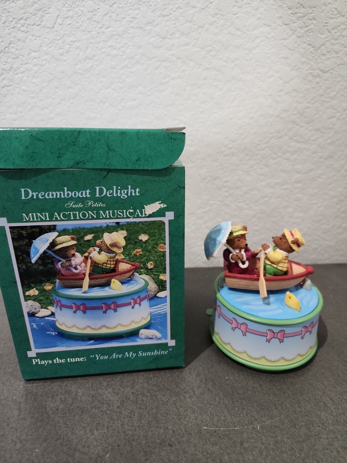 vintage Enesco music box features two bears in a boat and plays the tune 