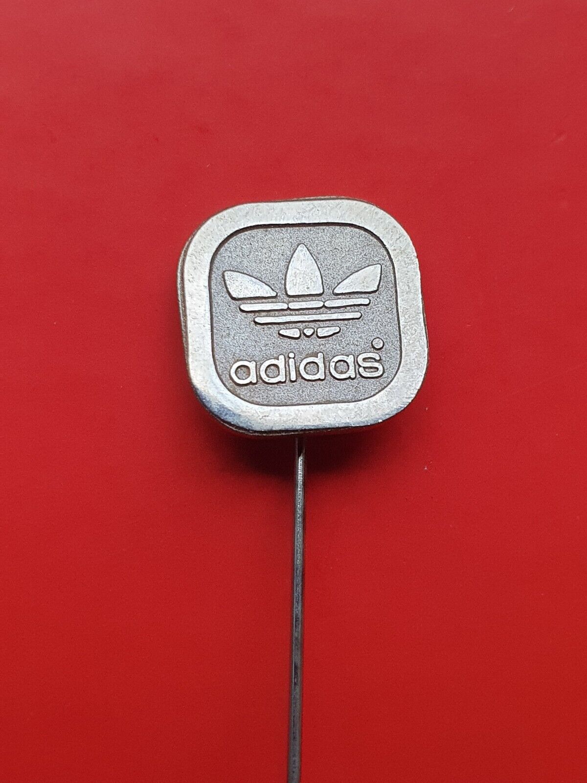Pin badge ADIDAS sport sports equipment Germany producer  silver variant