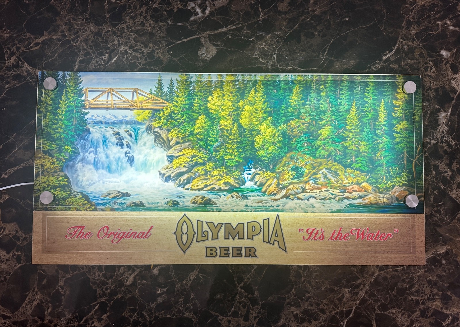 Classic Olympia Beer sign with waterfall scene 12\
