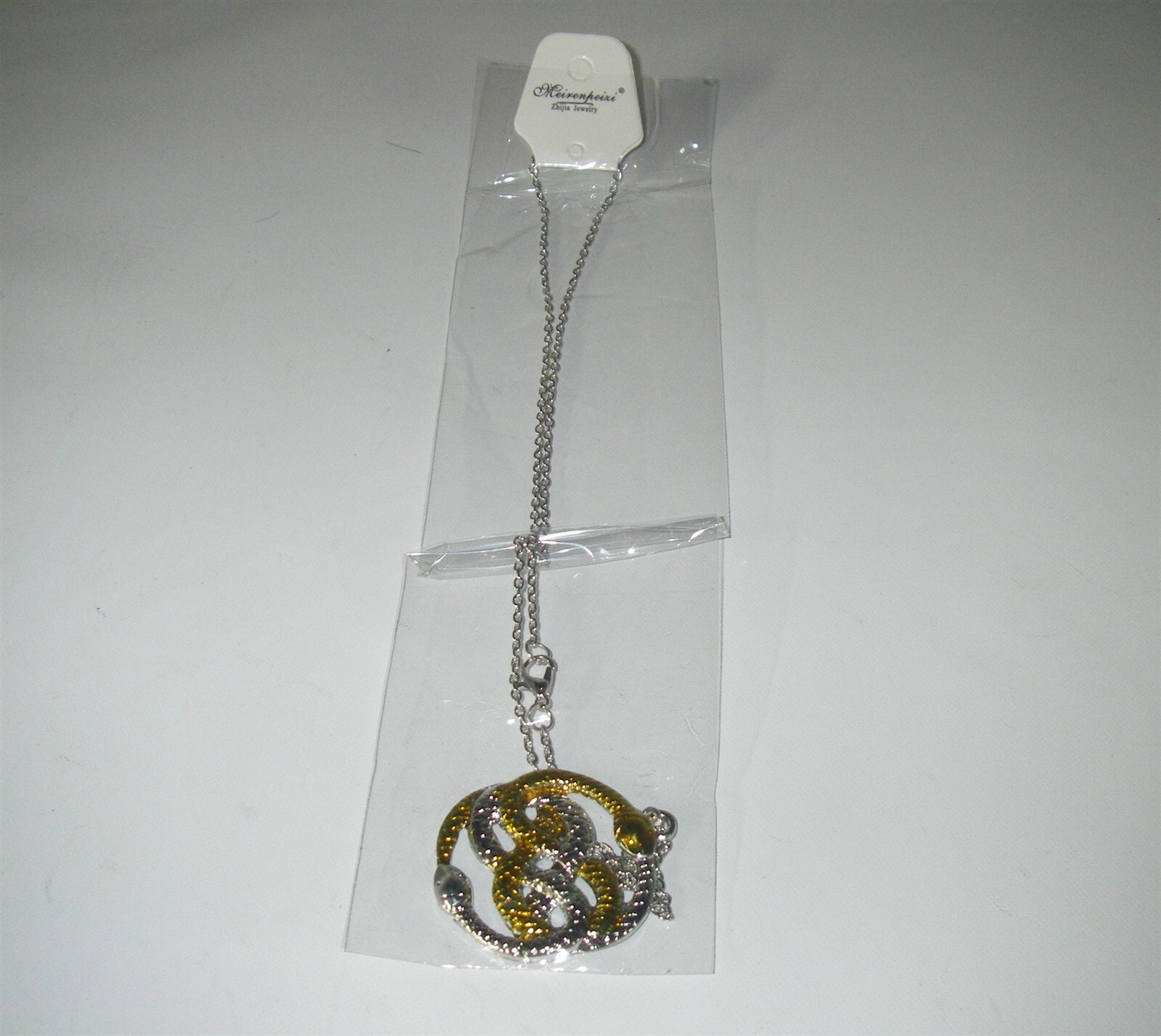 THE NEVER ENDING STORY AURYN NECKLACE THE NEVER ENDING STORY AURYN NECKLACE