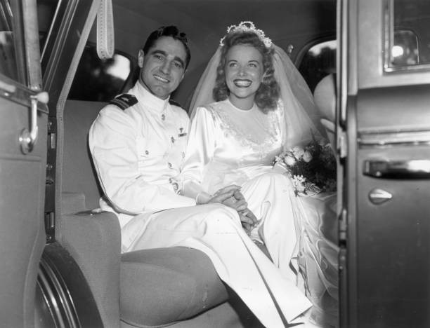 Lieutenant Mrs Mario de Grazia sitting backseat of a car holding h- Old Photo