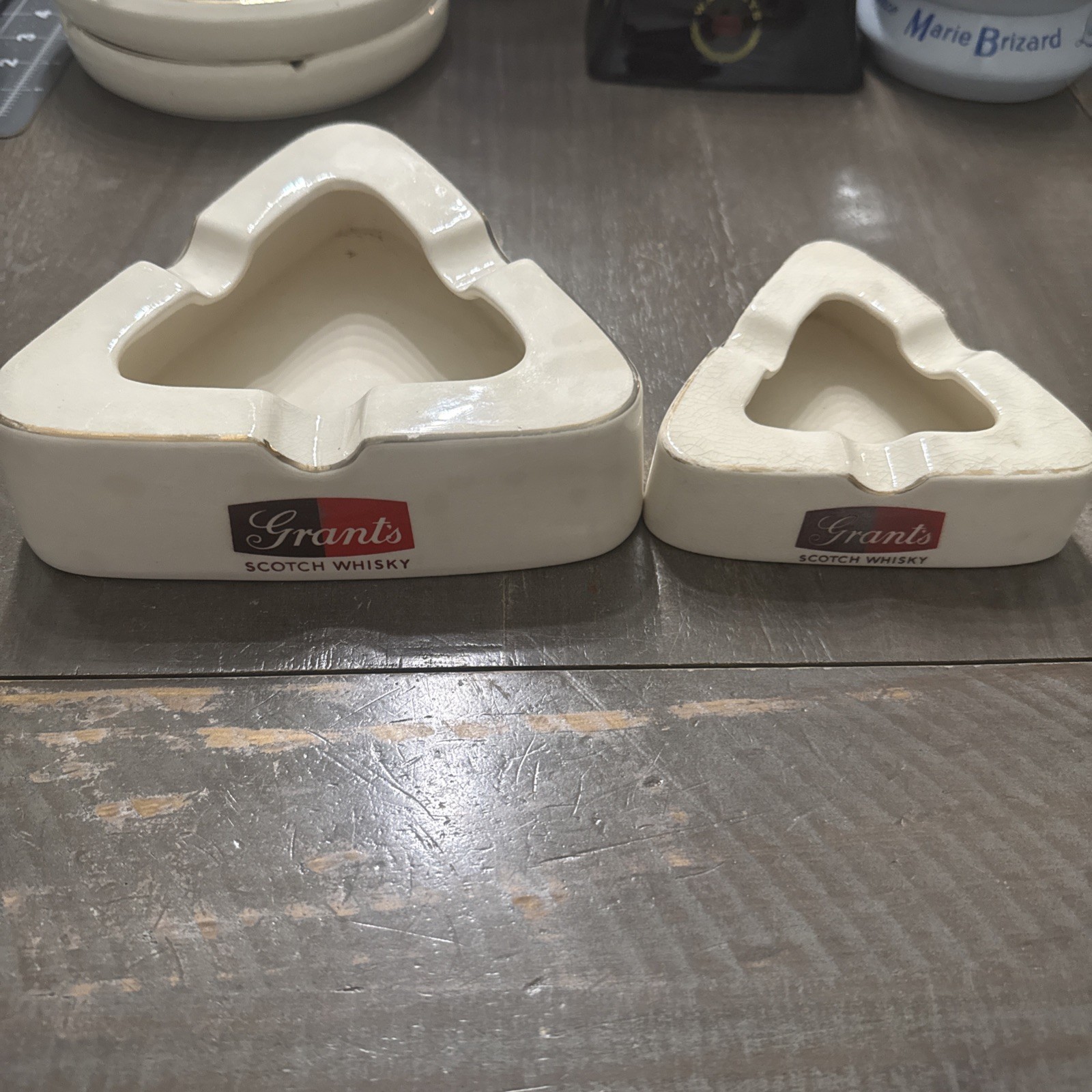 Large and small Vintage Grant’s Scotch Whisky Triangular Ashtray Wade England