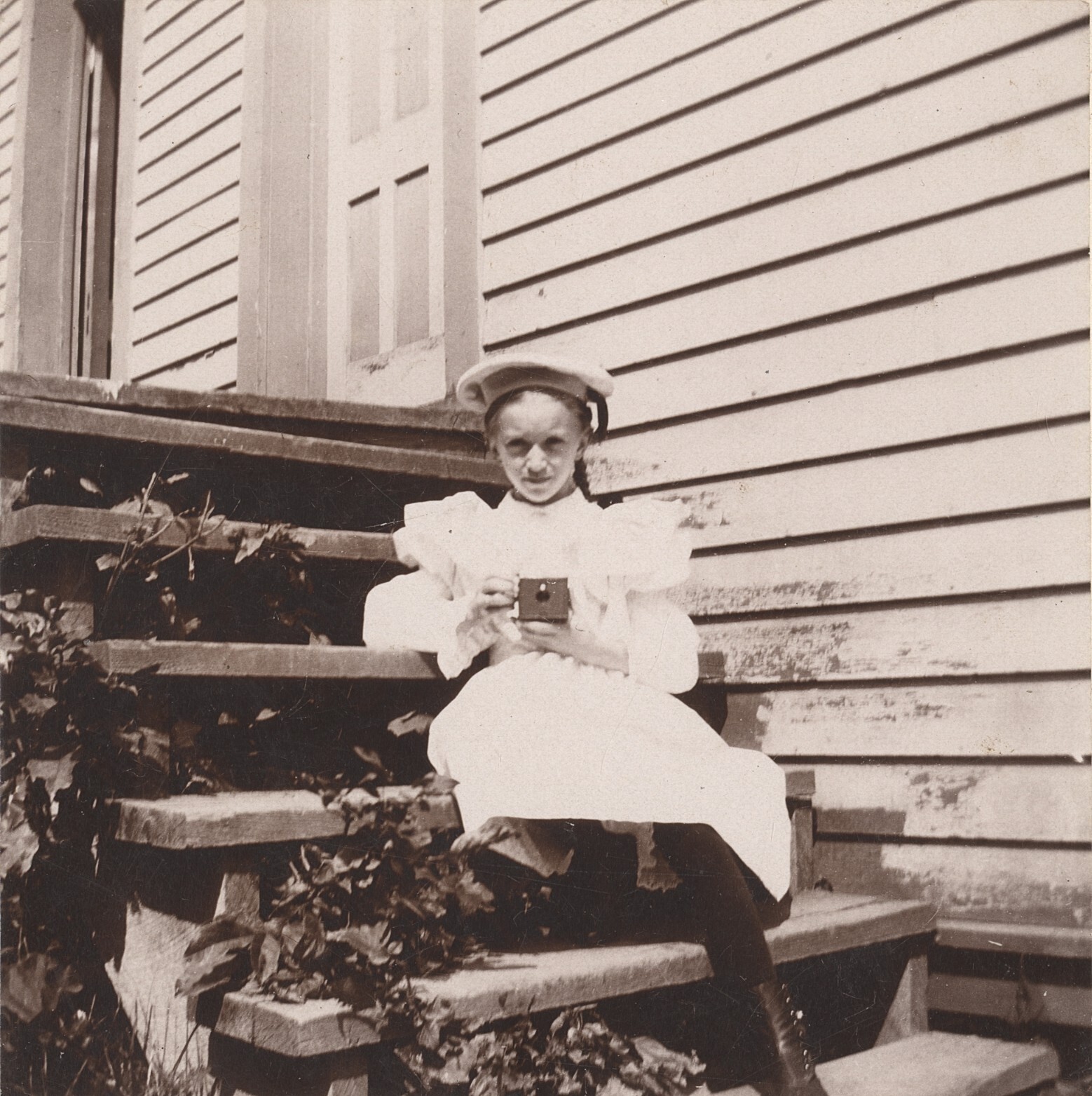 c. 1900 Young Girl Photographer Sitting on Stoop Cabinet Photograph
