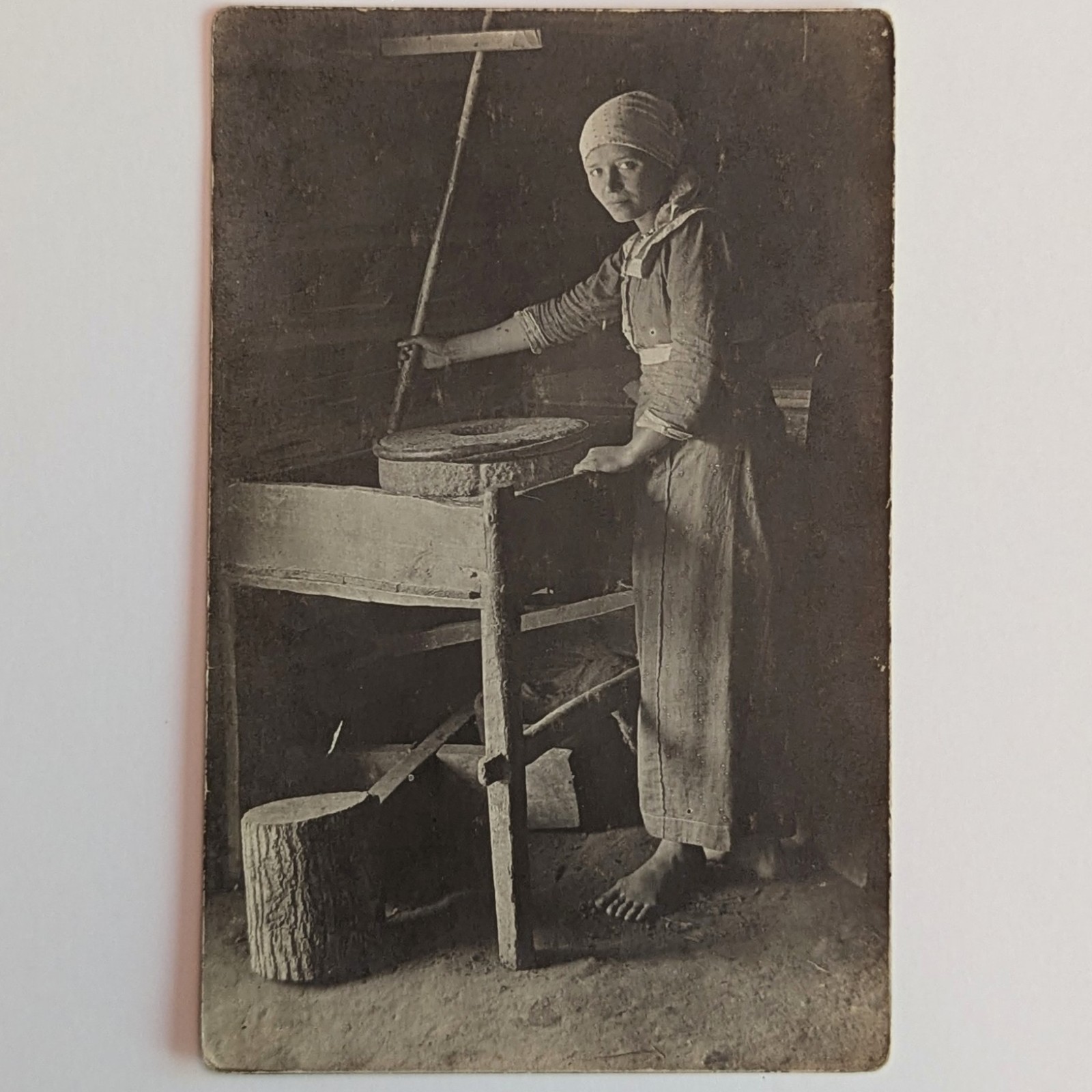 ​​​Antique RPPC Peasant Girl Grinding Grain Rotary Quern Hand Mill Stone Working