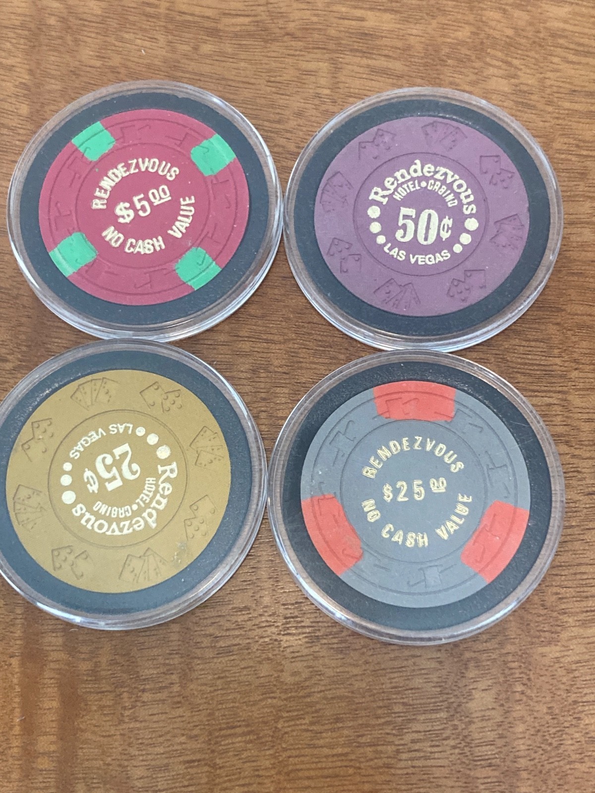 4 RENDEZVOUS CASINO LAS VEGAS .25 CHIP .50 CHIP 5.00 CHIP 25.OO CHIP 4 CHIP SET 4 RENDEZVOUS CASINO LAS VEGAS .25 CHIP .50 CHIP 5.00 CHIP 25.OO CHIP 4 CHIP SET