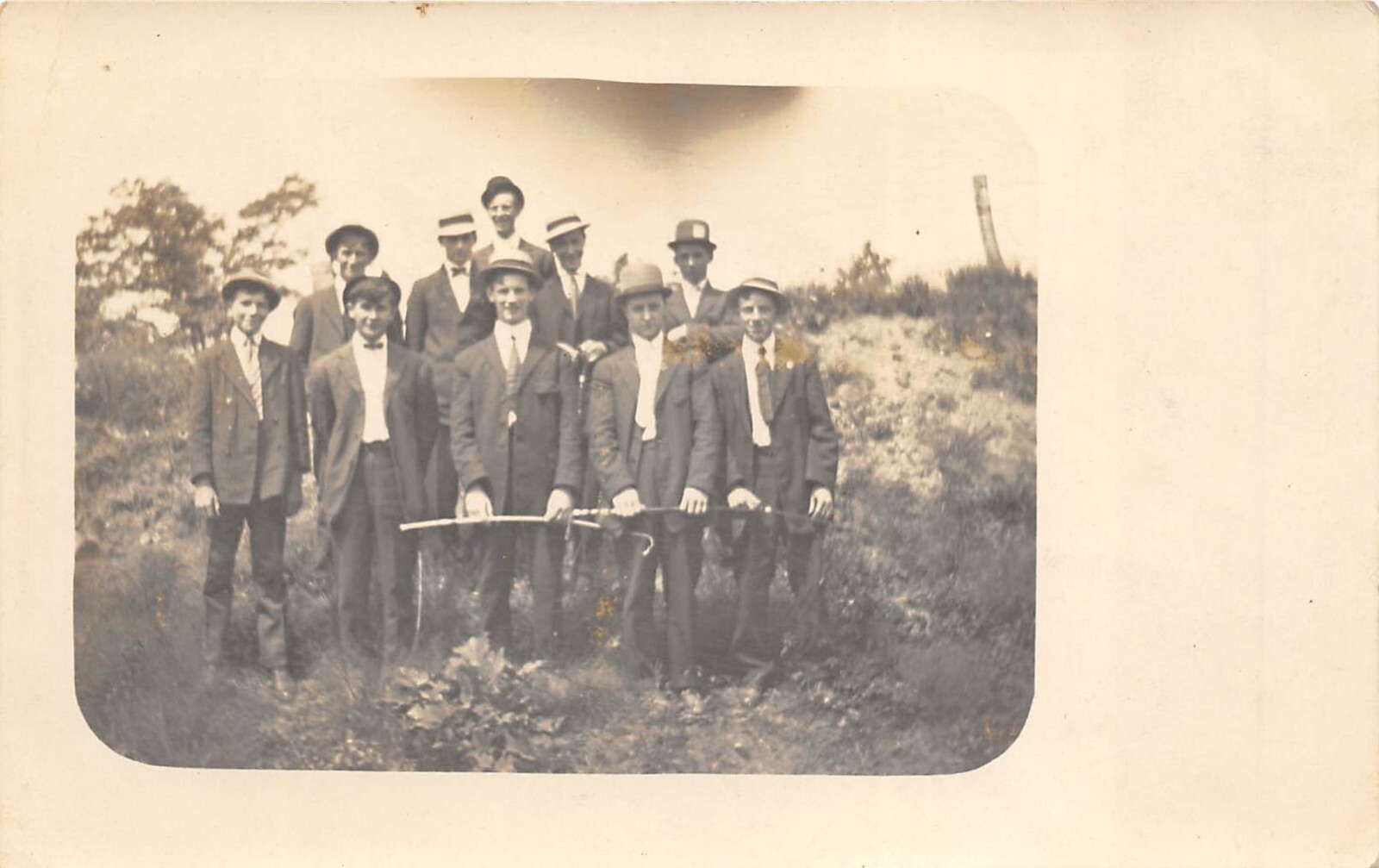 1910s RPPC Real Photo Postcard Large Group Men Standing Outside Holdings Canes