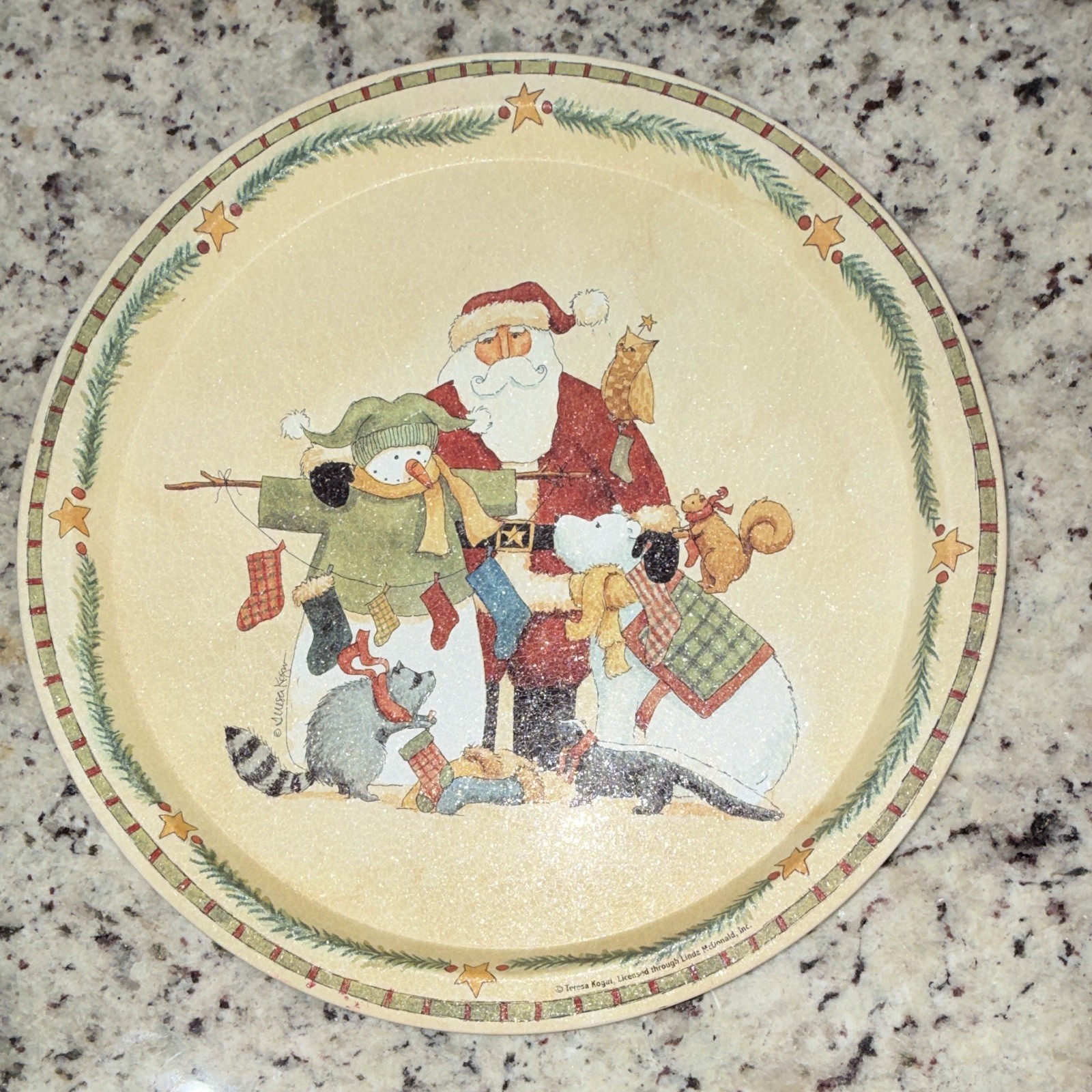 Vintage 13-inch round metal Christmas serving tray featuring a holiday scene.