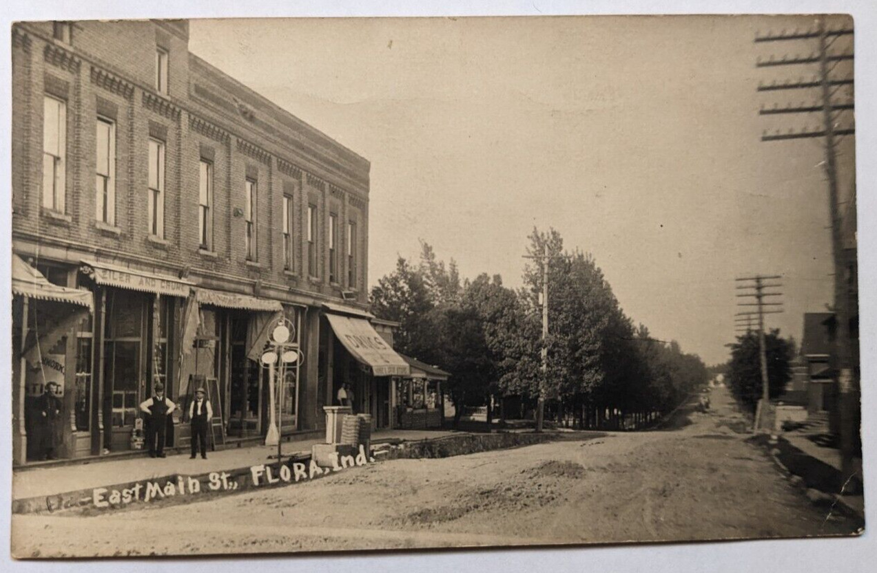 East Main Street View Flora Indiana Drug Store Shops RPPC Real Photo Postcard C2