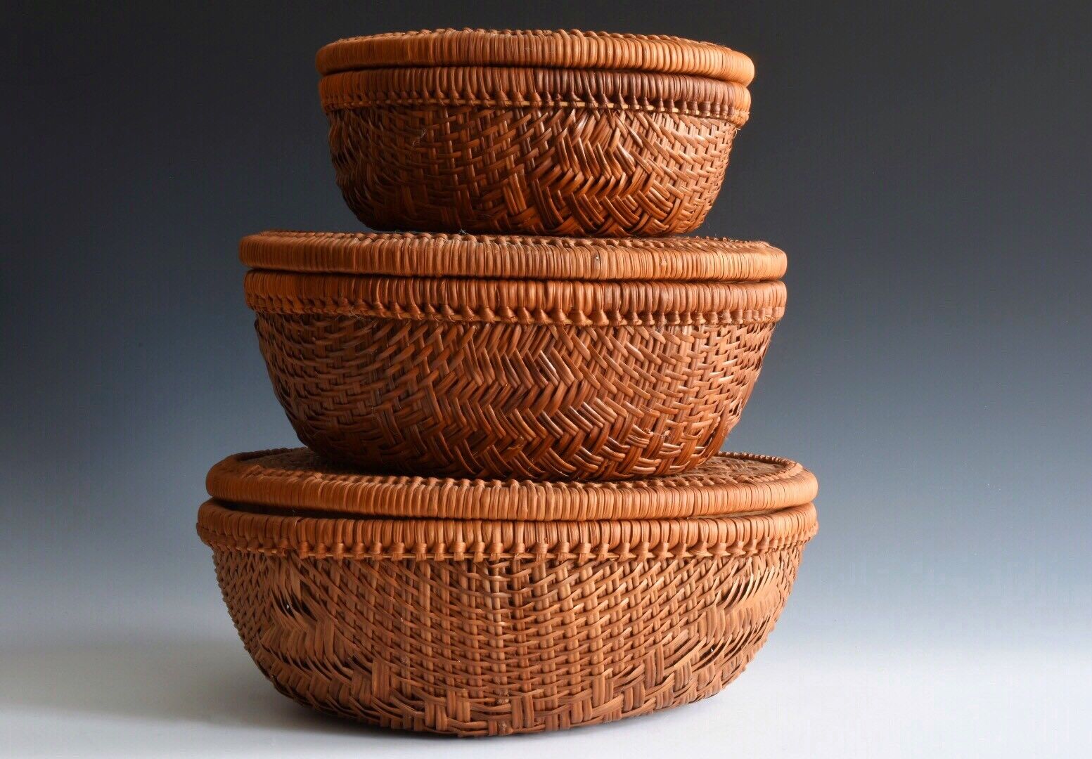 A Set Of Antique Graduated Hand Woven Japanese Baskets