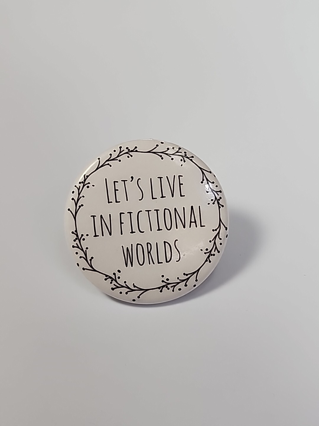 Let's Live in Fictional Worlds Button Pin Black & White 1.5