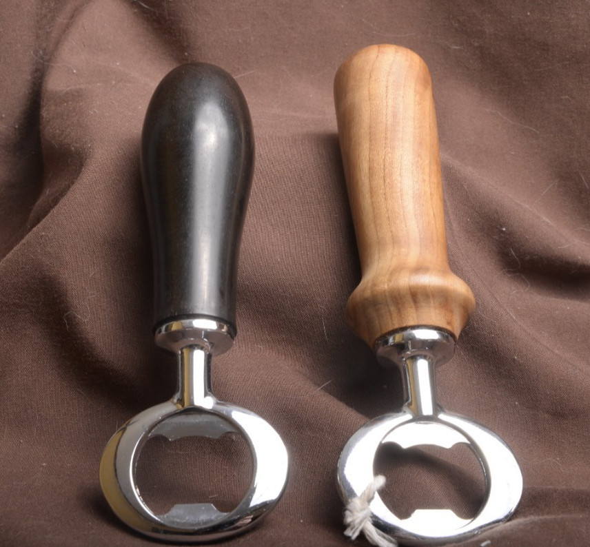 2 hand made bottle openers one Ebony one Maple