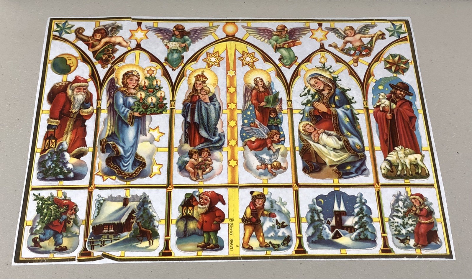 Vintage Die Cut Sheet of Scraps of Christmas Entities Santa  Glued on Paper - L8