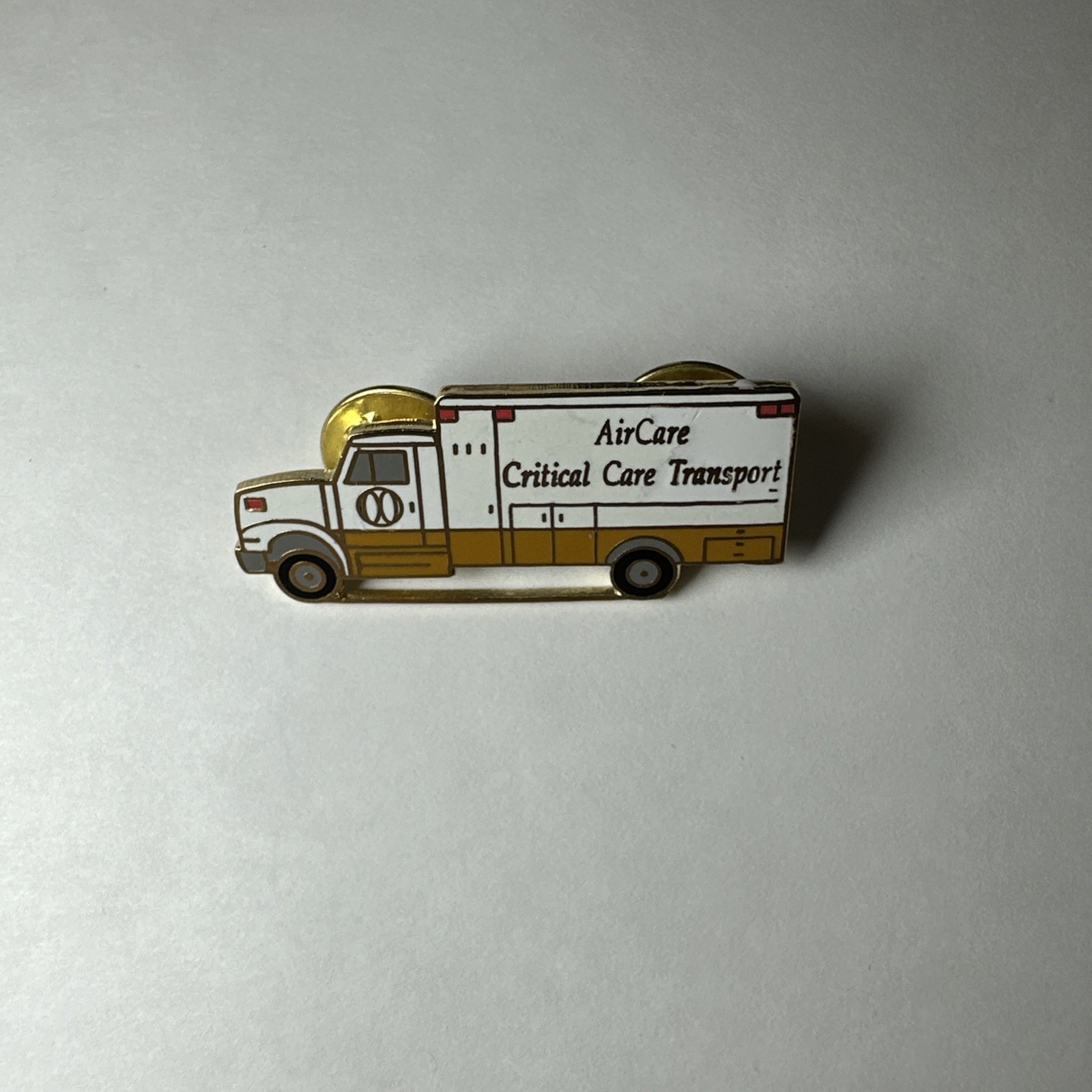 Vintage Air Care Critical Care Transport Gold Tone Ambulance Enamel Lapel Pin