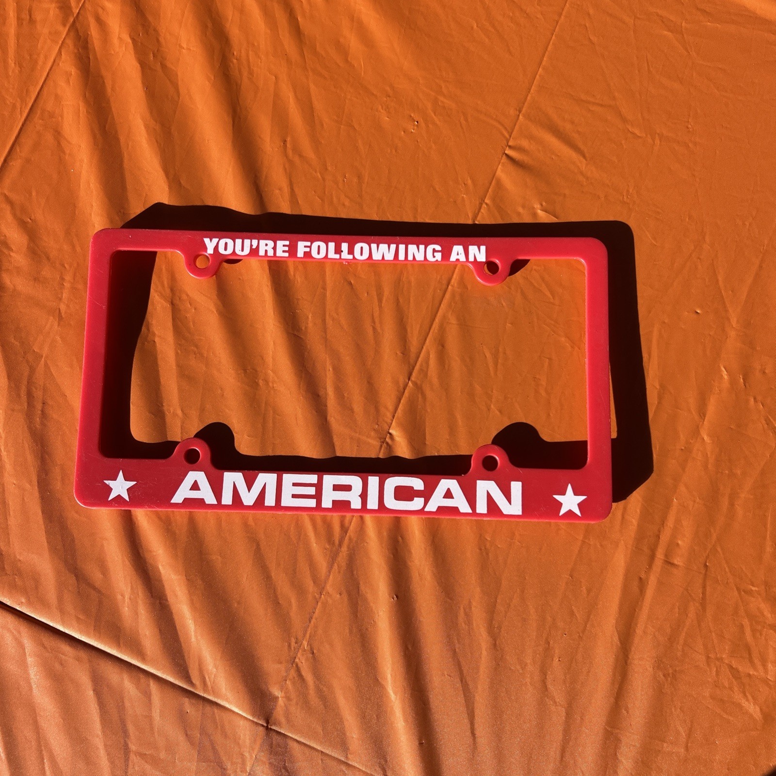You’re Following An American License Plate Frame Red and White Plastic New USA 