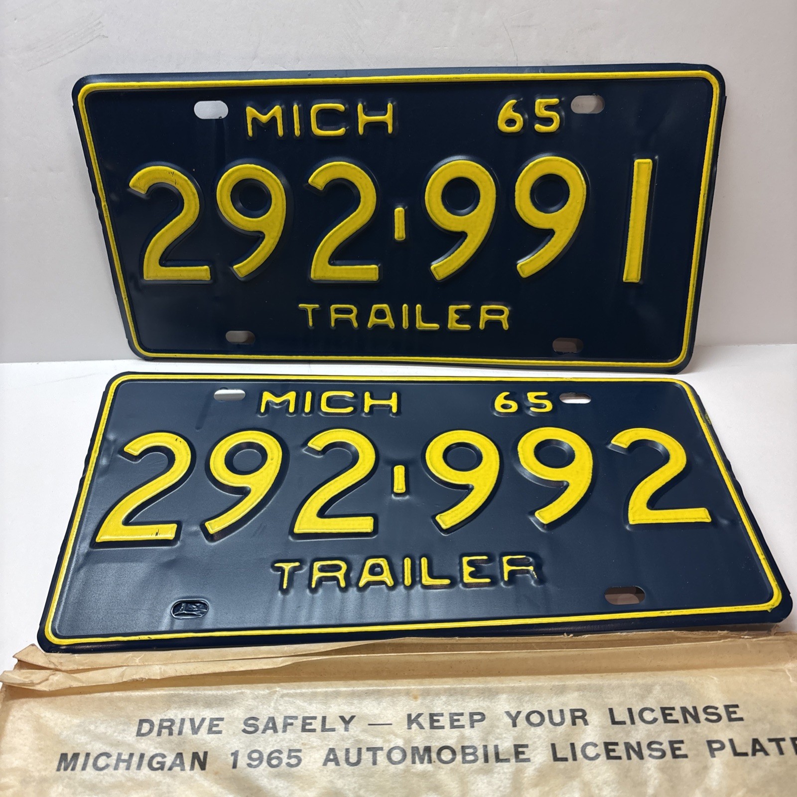 1965 Michigan Trailer License Plate Pair NOS Original 292991 & 292992 DMV Sleeve 1965 Michigan Trailer License Plate Pair NOS Original 292991 & 292992 DMV Sleeve